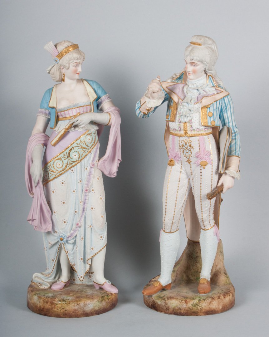 Pair of French painted bisque porcelain figures: 19th century; each dressed as 19th century man and woman, with "Paul Duboy" signature and mark, each approx. 18 in. H.
