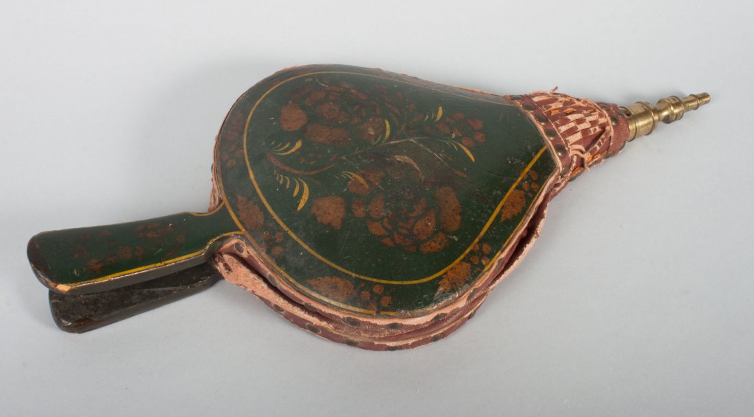 American fancy painted fireplace bellows: painted wood, leather, and brass bellows, green ground with floral stencil decoration, leather connectors and brass tip, 17 in. L.