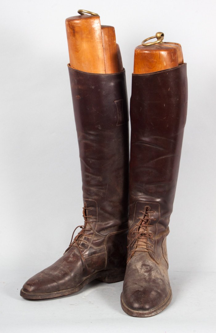 Pair of English leather riding boots: brown leather boots with three-part wood and brass boot forms, 19 in. H.