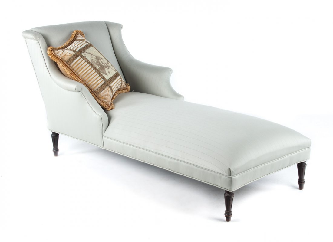 Louis XVI style upholstered chaise lounge: upholstered panel back, recessed arms and seat over frame, round-turned tapered and fluted legs, 31 in. H., 32 in. W., 70 in. D.