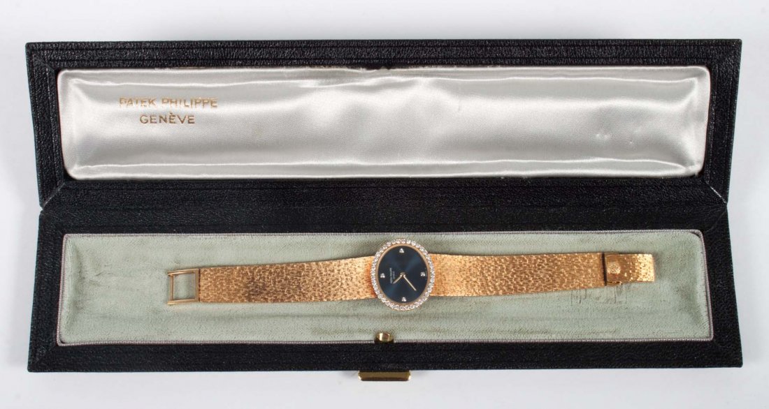 Lady's Patek Philippe 18K gold & diamond watch: in original box, 57 grams