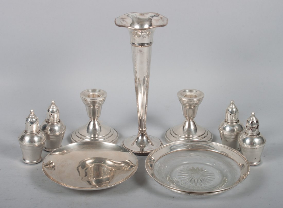 Group of sterling & weighted silver table items: including: pair of weighted low candlesticks, weighted trumpet vase, 2 pairs of weighted salt & peppers, a bread plate, and a silver and cut glass bottle coaster, 3.45 ozt of weighable silver