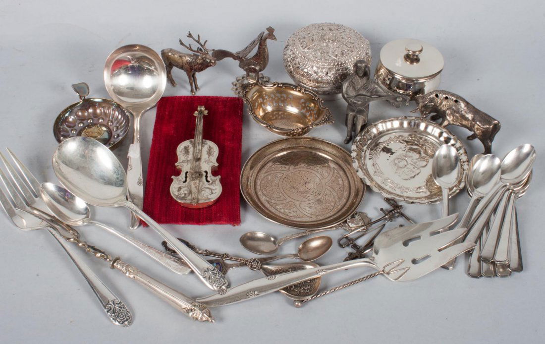 Miscellaneous silver and plated items: including: Gorham sterling nut dish, English silver mustard pot and coaster, Russian silver coaster, low grade silver bull-form toothpick holder, 17 pieces of plated flatware, and nine other plated it