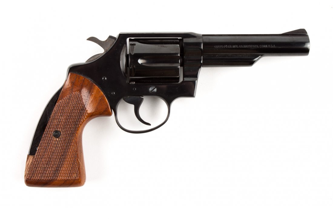 Colt "Police Positive" double-action revolver: serial #14227 R: .38 special cal.; the barrel 4 in. L.; metal parts blued; checkered walnut grips; 9 in. L. overall