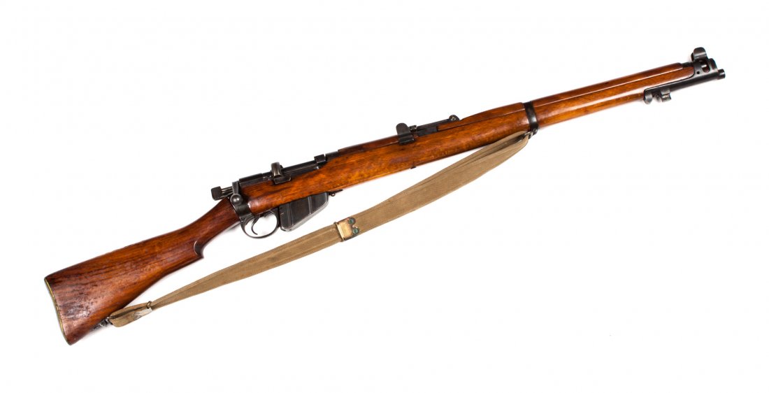 British Mark III SMLE bolt-action rifle: serial #70991: .303 cal.; the barrel 25 in. L; blued metal finish; figured walnut stock with beech forearm and hand guard; 44 1/2 in. L. overall