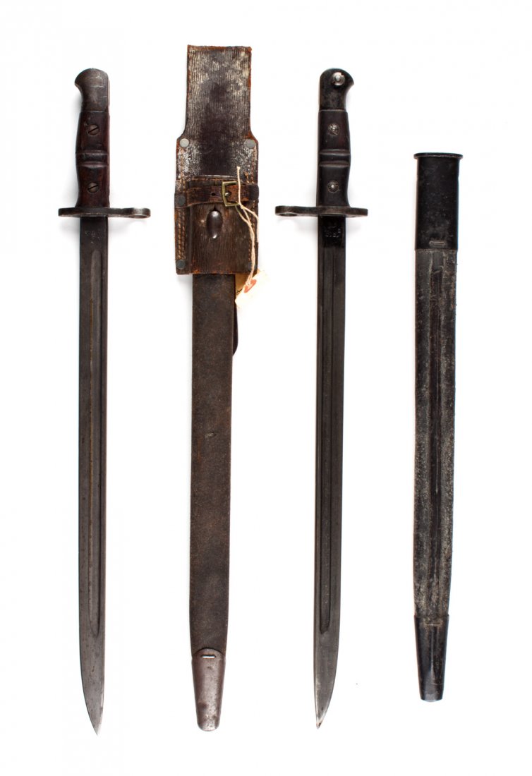 Two American-made bayonets for British rifles: of Pattern 14 Enfield rifles: one by Winchester, with leather and iron scabbard and belt-hanger; the other by Remington, with similar scabbard