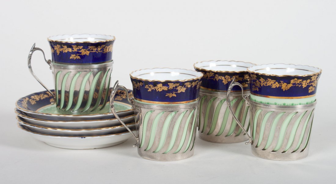 4 Royal Doulton cups & saucers w/ sterling liners: first half-20th century; cobalt banded parcel-gilt decoration, each cup with pierced sterling silver frames, 4.90 ozt. of weighable silver