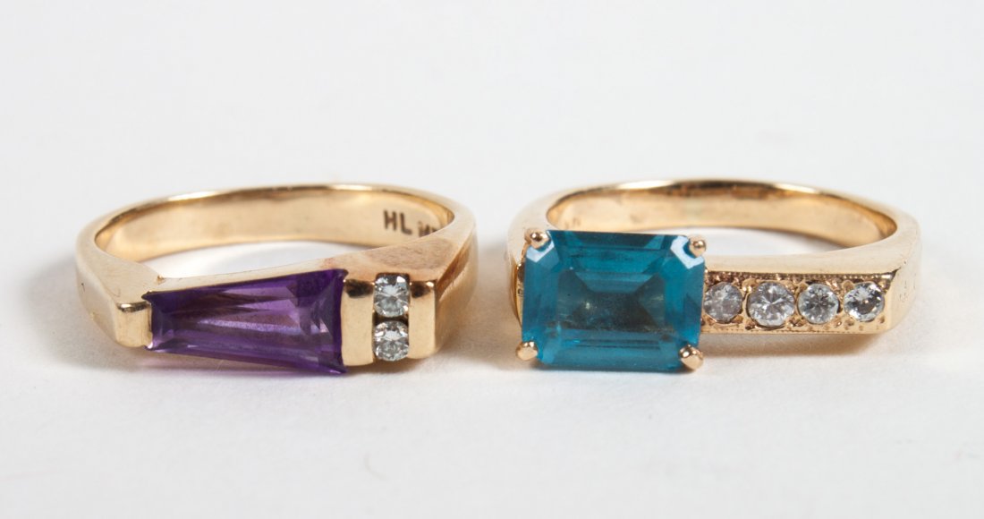 Two 14K gold & colored stone modern design rings: circa 1960's, 1) emerald cut blue topaz ring with four small diamonds, size 4 3/4, 2) tapered amethyst ring with two small diamonds, size 4; both designs attributed to Mark Nusinov, 8 grams