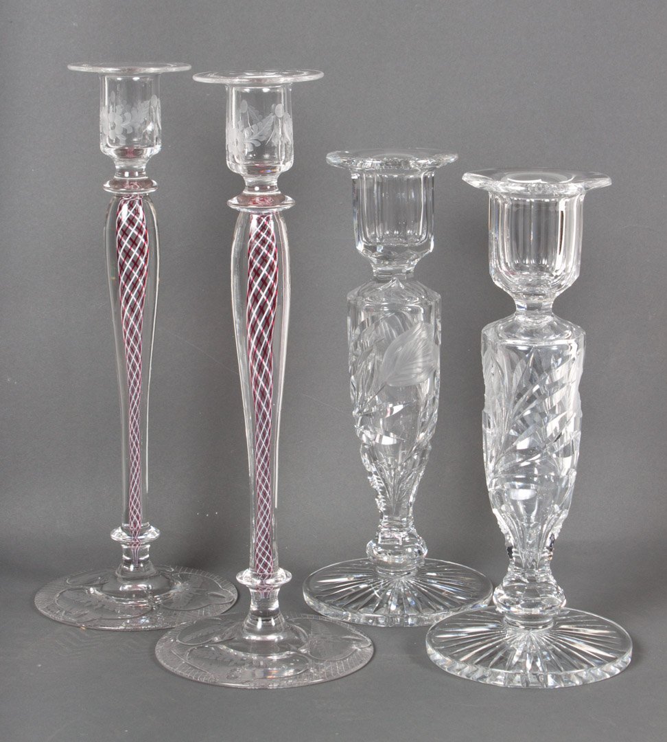 Two pairs of glass candlesticks: Pair of German air twist stems and etched glass candlesticks, 11 1/2 in. H., and a pair of American floral etched glass candlesticks, possibly Pairpoint, 10 in. H.