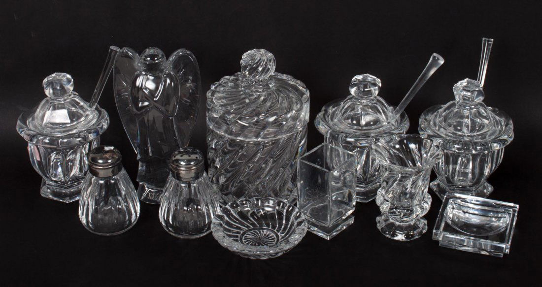 10 assorted Baccarat crystal table articles: articles include: 3 condiment pots with spoons, pair of shakers, toothpick holder, match holder, ashtray, covered jar, and angel figure, 6 in. H. of tallest