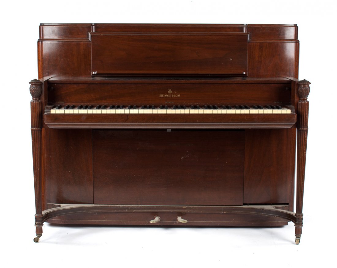 Steinway & Son mahogany console upright piano: Art Moderne style mahogany case with "diaphragmatic" soundboard and "accelerated action," model T294098, dated 1938, with matching bench, 44 1/2 in. H., 57 1/2 in. W.