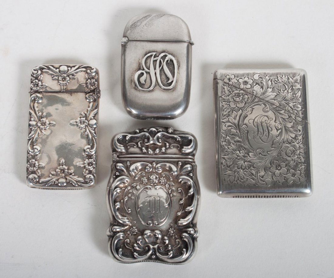 Four American sterling silver match safes: none with apparent maker's mark; 3.25 ozt.