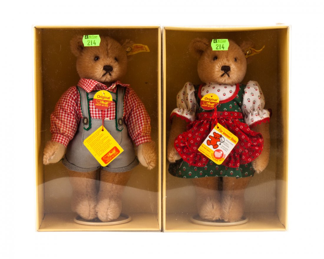 Steiff girl and boy teddy bears: blonde mohair jointed teddy bears, one in print dress and other with overalls and plaid shirt, in original box, 10 in. H.
