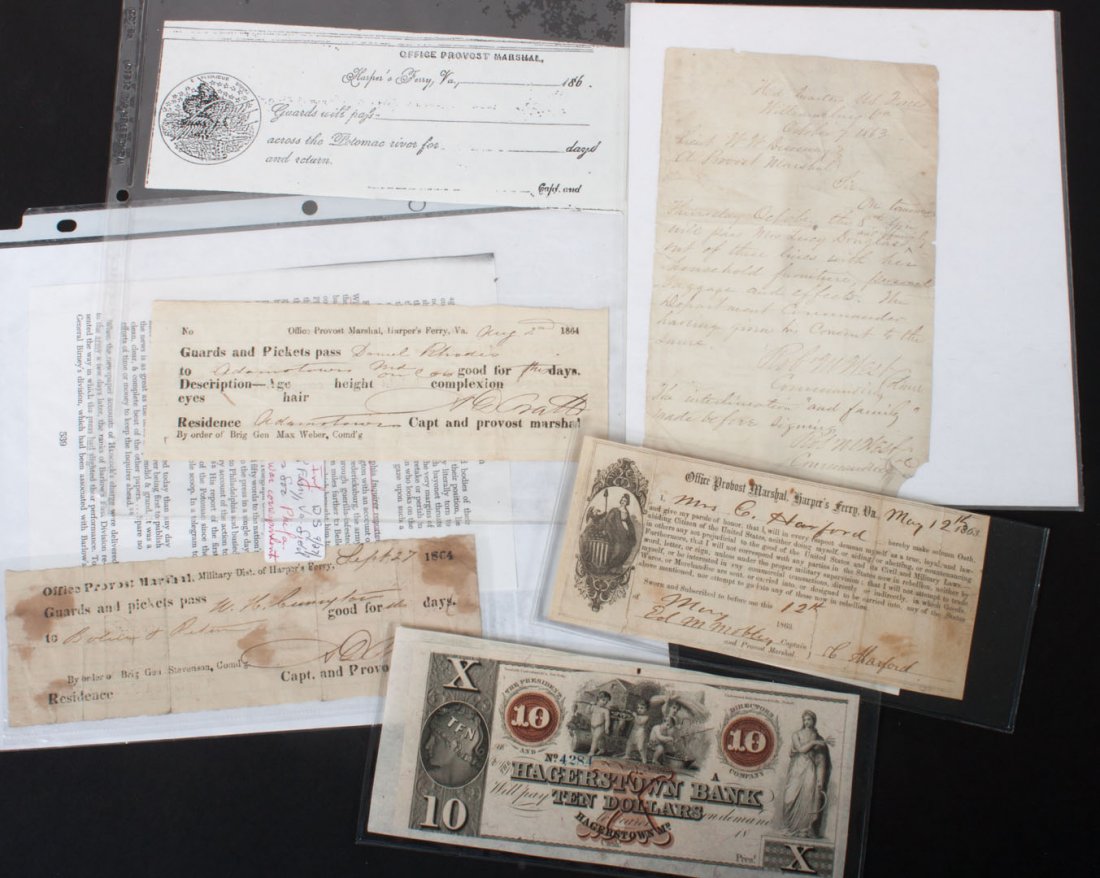 [Civil War] Three passes and an oath: comprising: 1) Handwritten pass, Williamsburg, Va., Oct. 7, 1863, allowing Mrs. Lucy Douglas, family and personal belongings across the lines, signed twice by Robert M. West; 2) Part-printed oath of l