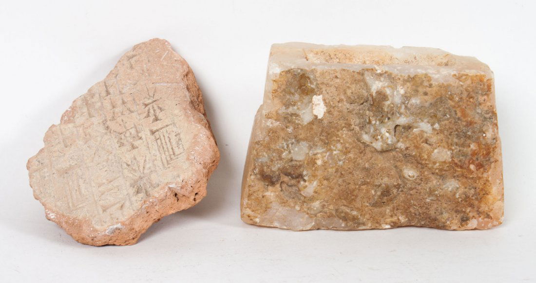 Two antique Middle Eastern writing fragments: possibly before the Common Era; clay fragment with cuneiform characters, approx. 4 1/2 in. L., and alabaster fragment with character writing, 4 1/2 in. L.