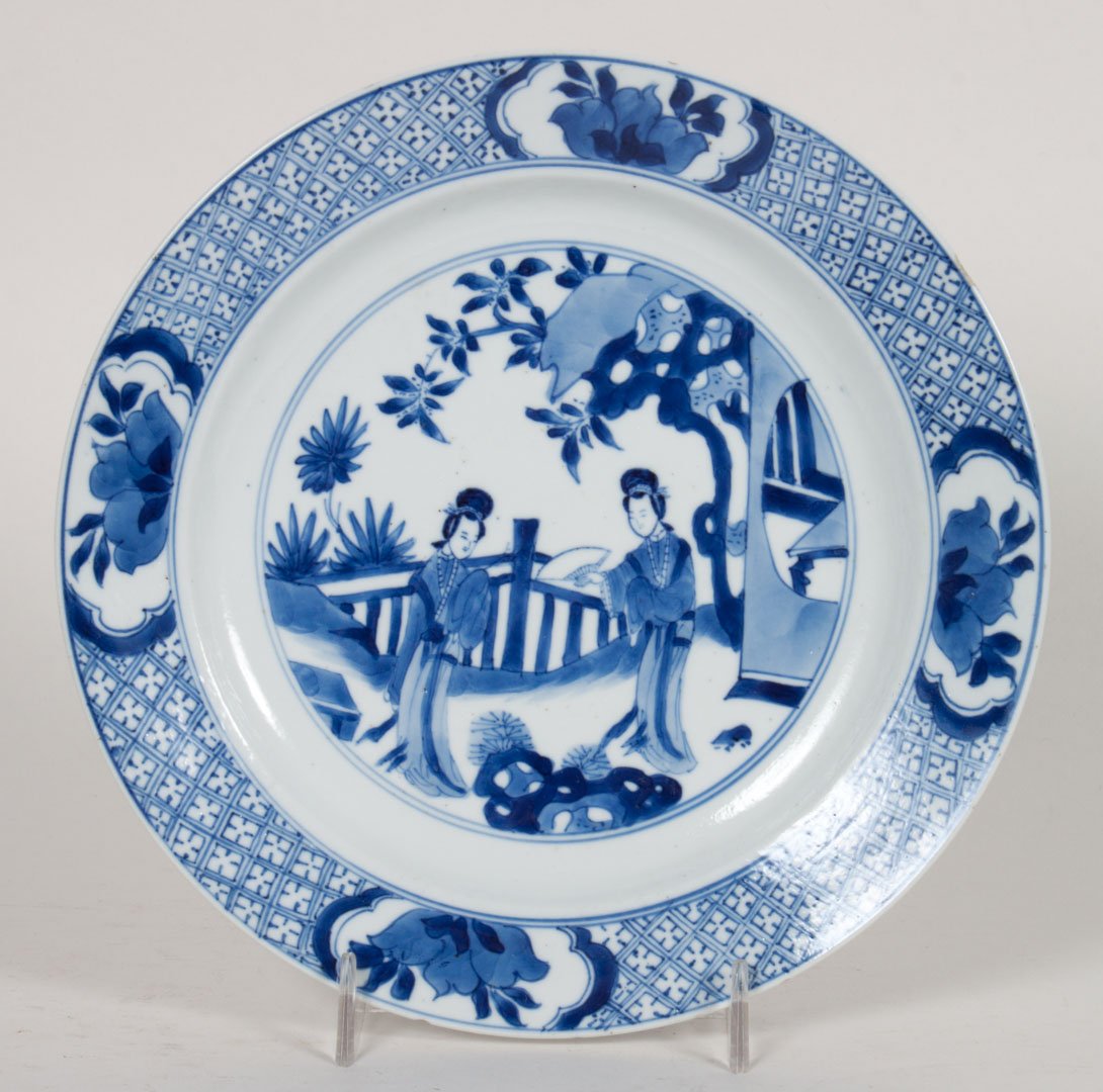 Chinese Export porcelain blue and white plate: Kang Xi, circa 1690; border with cross-hatch design and four floral vignettes, center with "Eliza Long" figures in garden, with character reign mark, 8 in. Diam.