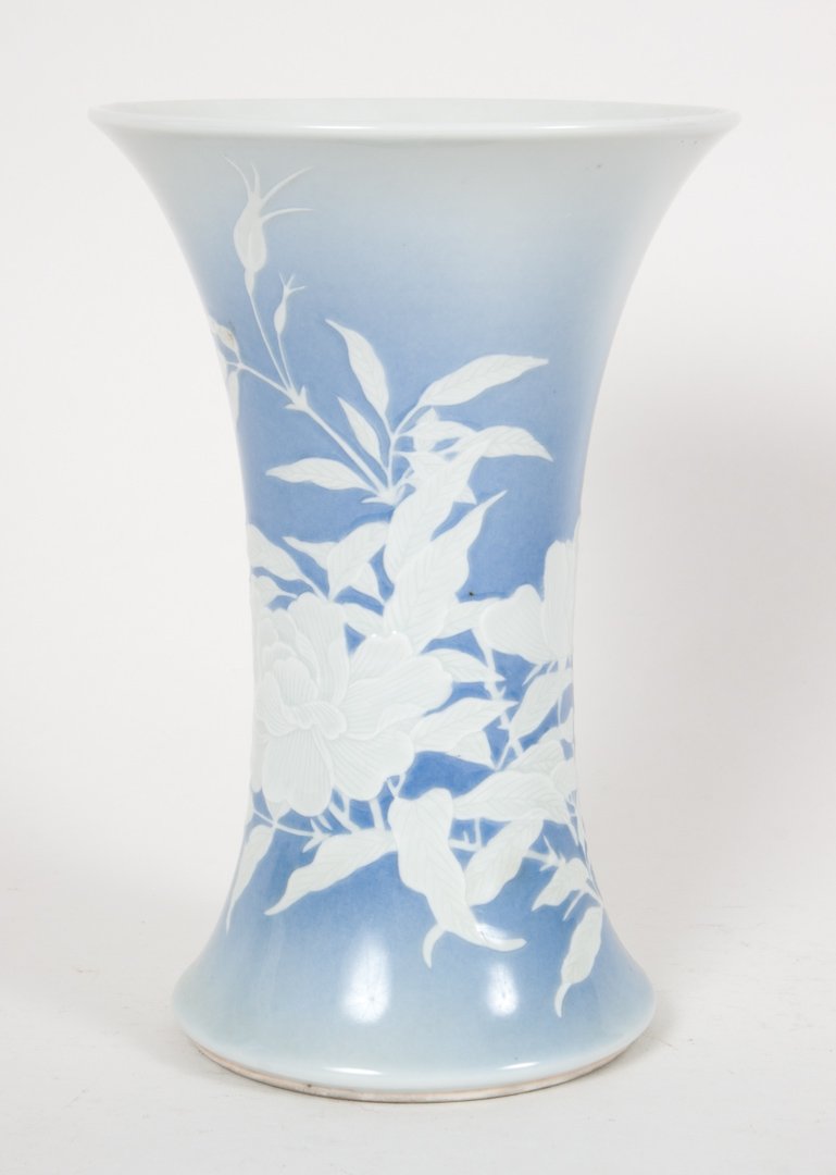 Japanese studio porcelain beaker vase by Yohei: circa 1900; light blue ground with peony slip glaze decoration with impressed character mark "Seifu Yohei," 7 1/4 in. H.