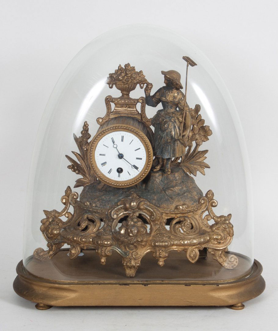 Napoleon III gilt-metal figural mantel clock: second half-19th century; modeled as peasant girl farmer on rocky ledge with clock case, with blown glass dome and gold painted wood base, clock - approx. 12 in. H.
