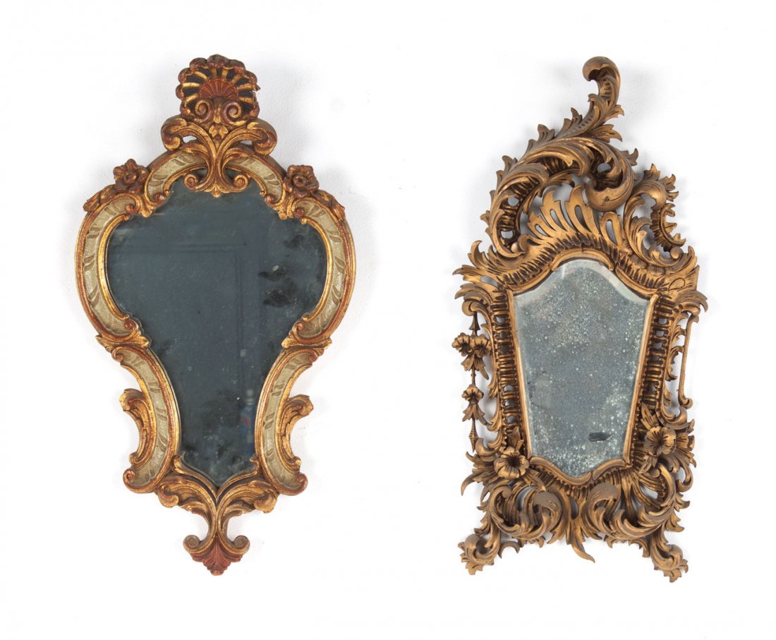 Two French giltwood mirrors: 20th century; first mirror with elaborate scroll frame and floral embellishments, 27 in. H., 14 in. W., other mirror with shell cornice and painted and gilt frame, 22 in. H., 12 in. W.