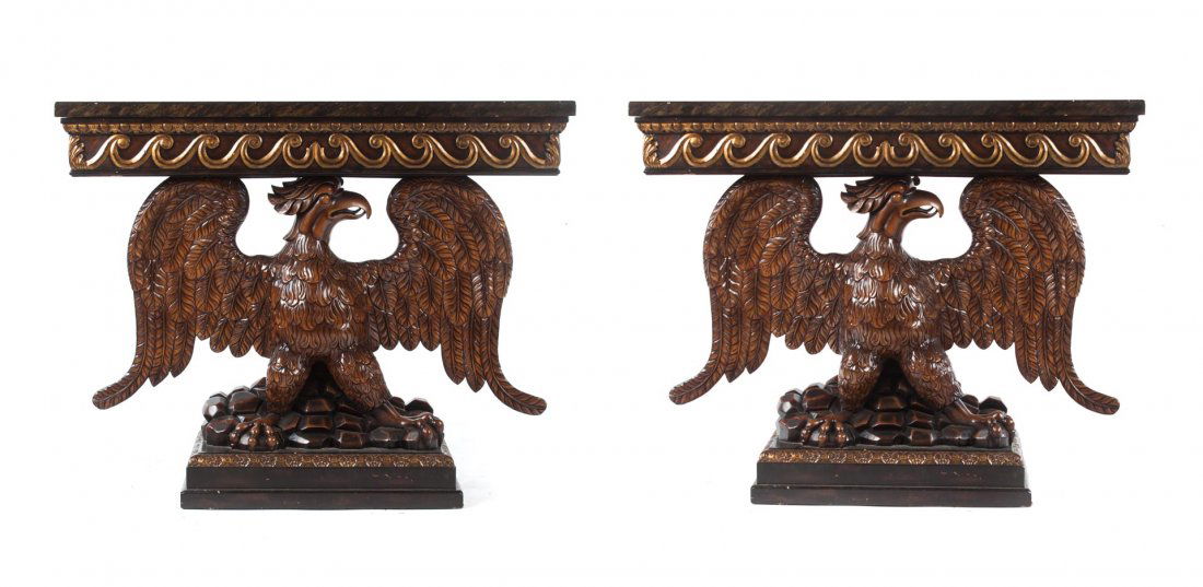 Pair of George II style eagle base console tables: 20th century; in the manner of William Kent, Theodore Alexander, rectangular top supported by eagle with spread wings standing on rock pile on molded base, 39 in. H., 48 in. W., 18 1/2 in. D.