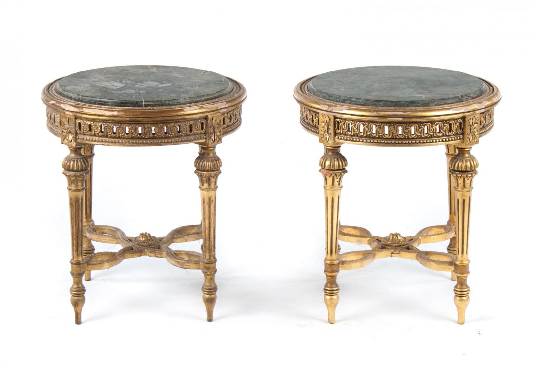 Pair of Louis XVI style giltwood tabourets: round green marble tops, carved round fluted legs connected by shaped stretchers, 20 1/2 in. H., 18 in. Round