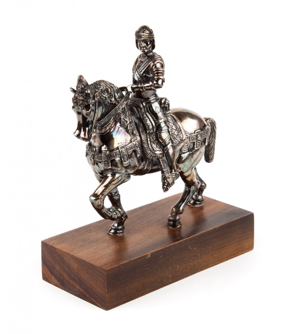Buccellati sterling silver sculpture: rendering of Andrea del Verrocchio's statue of Bartolomeo Colleoni in Venice, mounted on a wood base, 8 in. total H., 54.40 ozt. t.w. (including base)