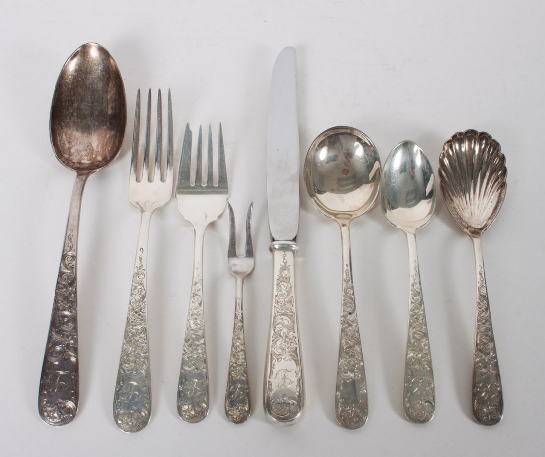 Kirk "Old Maryland Engraved' sterling flatware: comprising 64 pieces; together with a Warner silver serving spoon; 71.60 ozt. of weighable silver