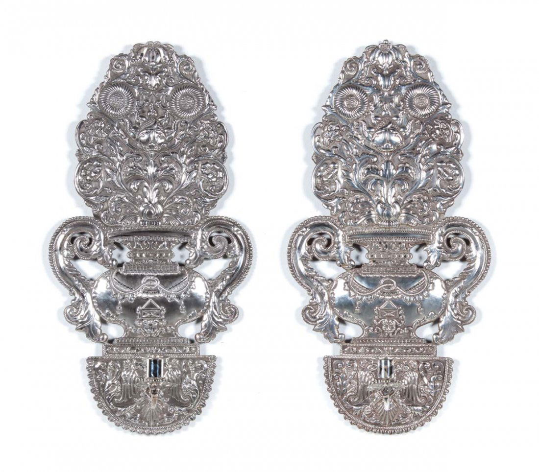 Pair of Indian silver repousse wall sconces: 19th century, with exotic wood rear panels, 30 in. H., .940 fine