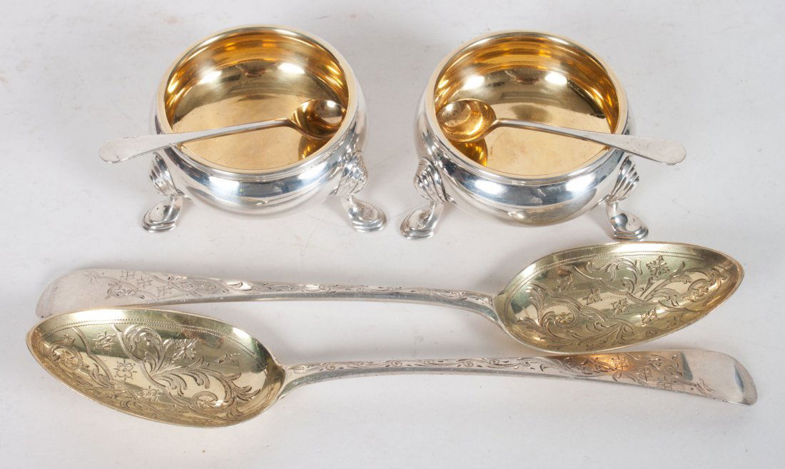 Pair of English sterling silver serving spoons: London, 1803-04, with gilded bowls, maker's mark rubbed; together with a pair of English sterling silver salt cellars and spoons; 12.55 ozt. t.w.