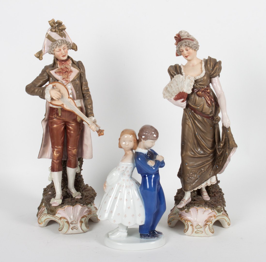 Pr Royal Dux figures and Bing&Grondhal figure: Royal Dux figures of 18th century man with lute and woman with fan, 13 in. H., Bing & Grondhal figural group "Pardon" #2372, 7 1/2 in. H.