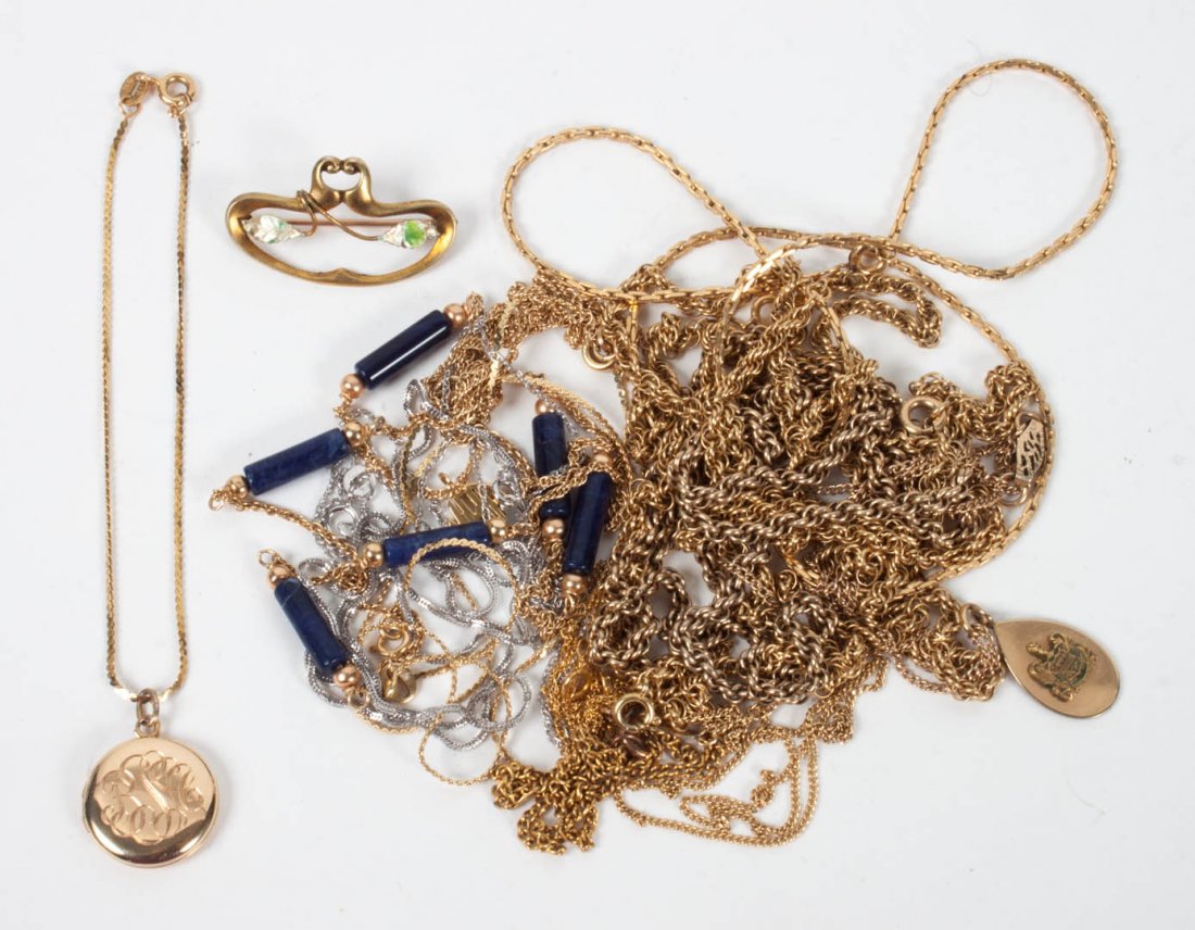Seven 14K gold chains: including: three yellow gold (one broken), two with elongated blue glass beads, and two white gold; together with a 14K gold bracelet with monogrammed locket, 10K gold pin and six gold filled necklace