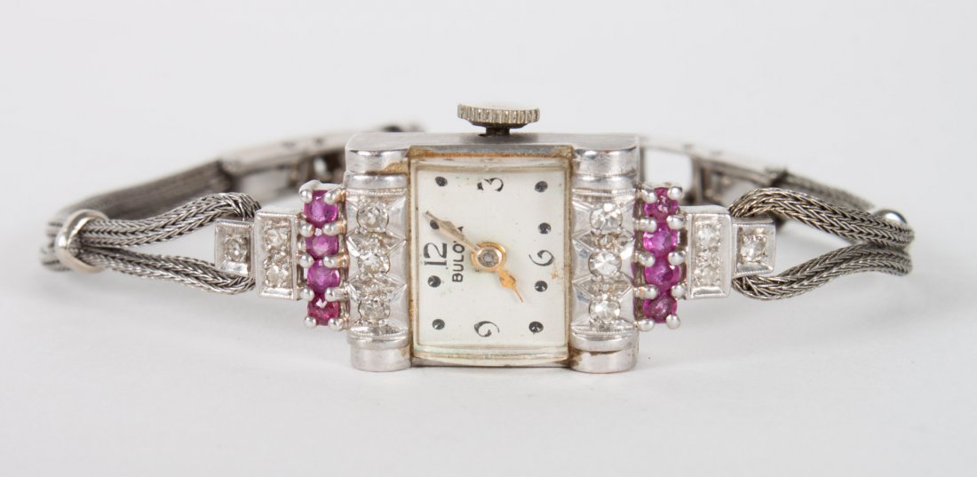 Lady's Bulova Retro style wrist watch: mid 20th century, set with small diamonds and rubies; flexible gold-filled strap