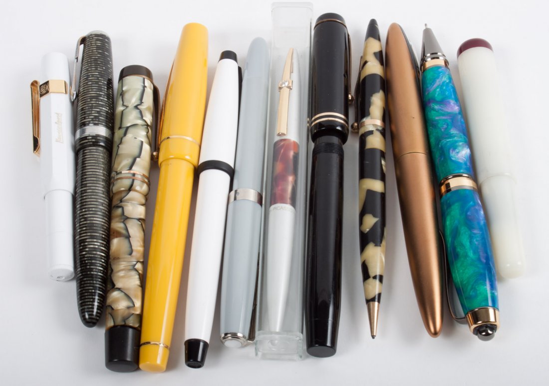 Twelve assorted pens and pencils: nine fountain pens, two pencils, and one roller ball pen