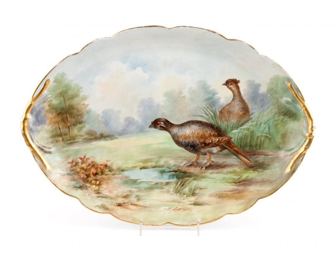 Limoges painted porcelain game platter: dated 1911; image of grouse in field, signed on verso, "Claude E. Laeber 1911," and titled "Grouse," 18 in. L., 13 in. W.