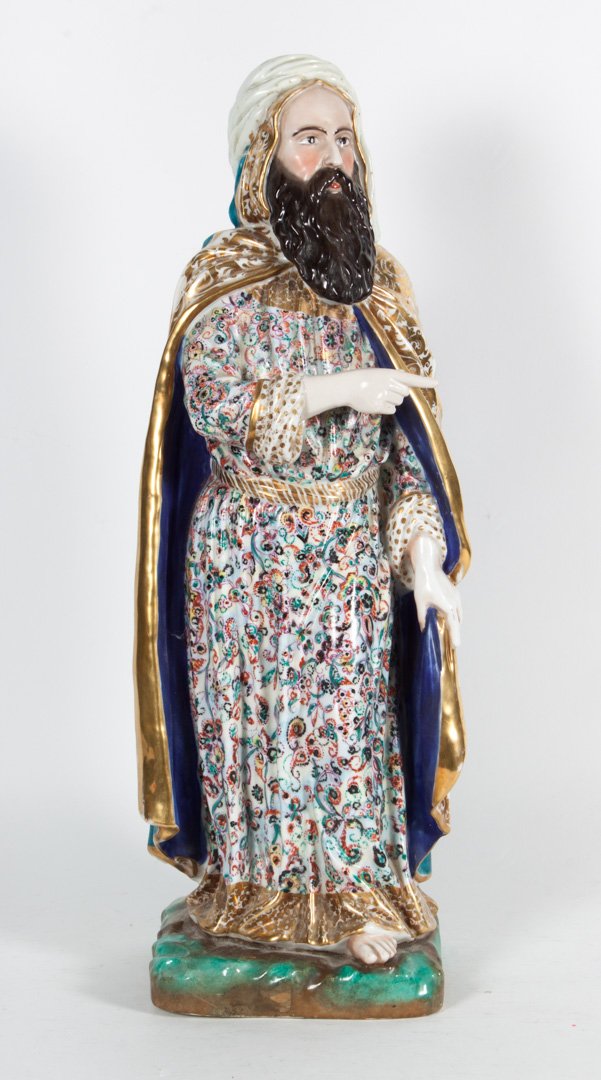 French porcelain figure of a magi: second half-19th century; cloaked figure in elaborate polychrome tunic and robe, 21 in. H.