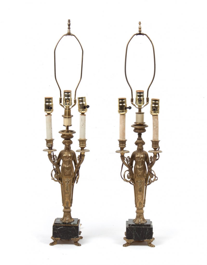 Pair of Napoleon III ormolu figural lamps: third quarter-19th century; each modeled as classical maidens with candle socket in each hand and on head, mounted on stepped marble base on paw feet, 23 in. H, now electrified