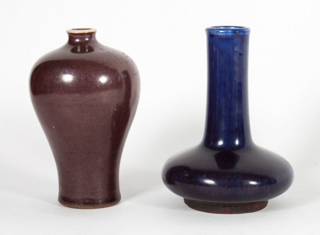 Two Chinese monochrome porcelain vases: cobalt glazed bottle-form vase with character mark underneath, 5 in. H., and aubergine glazed vase, 5 in. H.