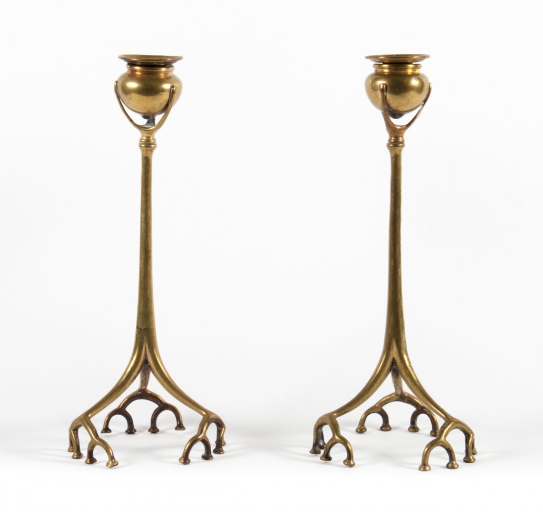 Pair of Tiffany bronze Root candlesticks: first quarter-20th century; pot-form socket with straight stem supported by tri-form base with tree root feet, impressed "Tiffany Studios New York 1200," 12 in. H.
