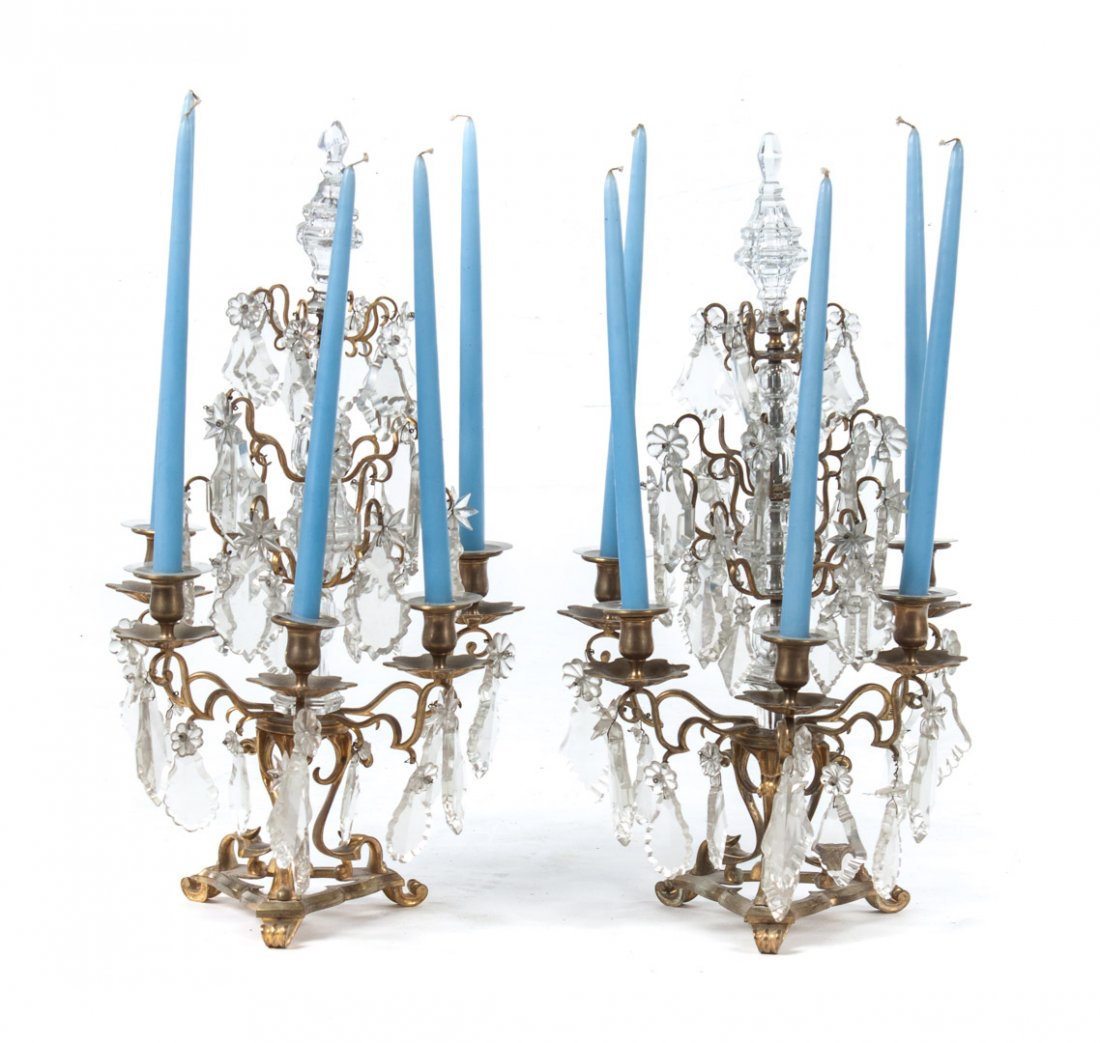 Rococo style brass and glass candelabra: second half-19th century; each 5-light candelabra with cut glass drop prisms and glass floral rosettes, 26 in. H.