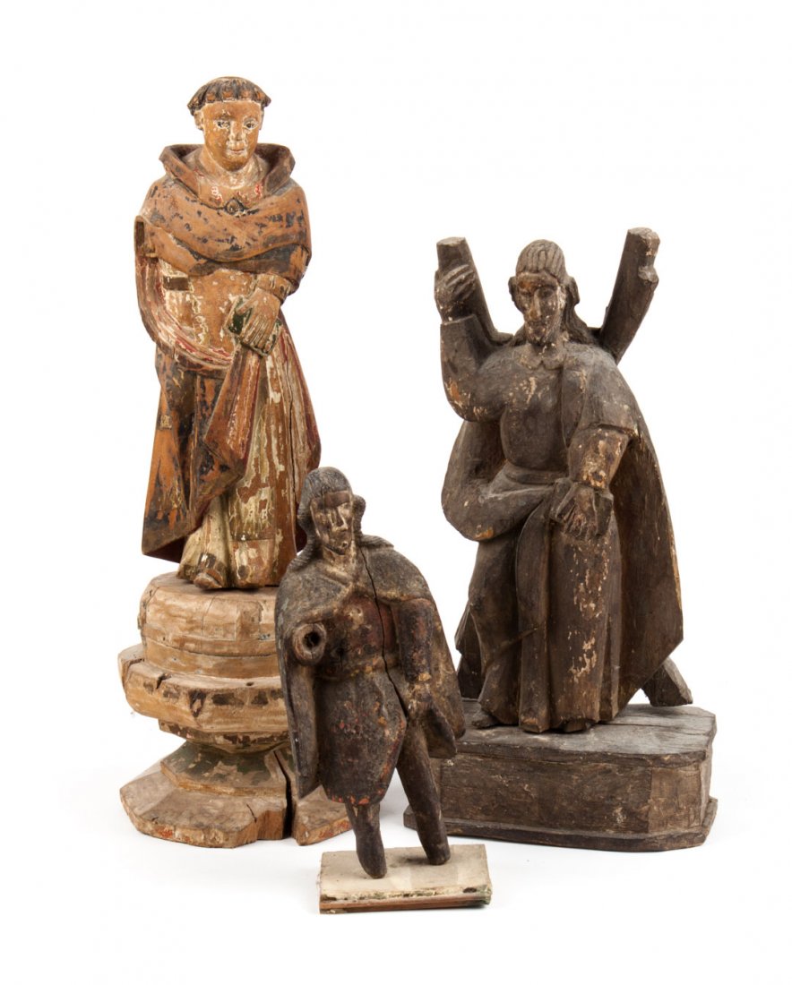 Three carved and polychromed wood Santos figures: 19th century, including: Crucified St. Andrew, St. Dominick, and male saint, 12 to 20 in. H.