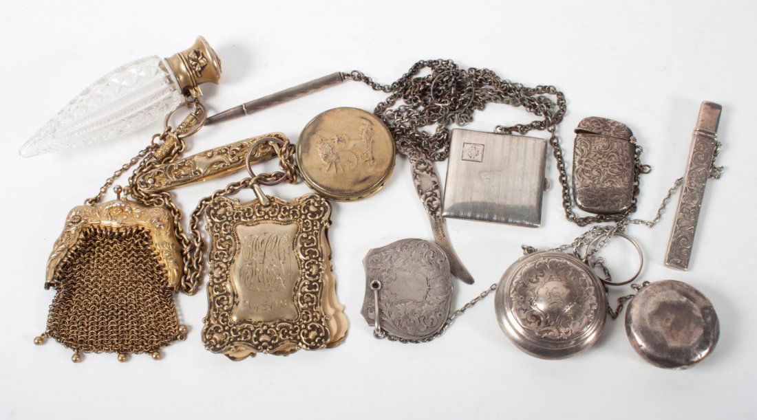 Three chatelaines: 1) chased sterling silver chatelaine with four appendages, 2) vermeil chatelaine with four sterling silver appendages, 3) vermeil chatelaine with six appendages