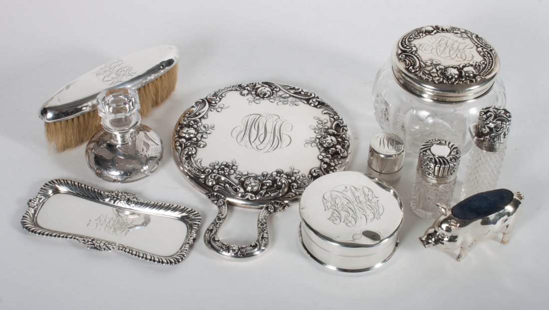 American & continental sterling dresser items: including: pin tray, hand held mirror, garment brush, three sterling mounted scent bottles (one missing stopper, one stopper broken), round trinket box, sterling lidded powder jar, and two pin cushion