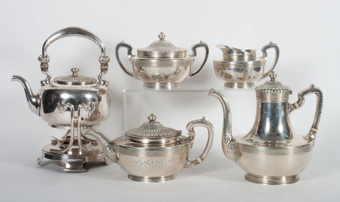 Gorham sterling silver 4-piece coffee/tea service: various date marks, with urn forms and threaded bands, including: coffee pot (8 in. H.), teapot, covered sugar bowl, and cream pitcher; together with a similar silver-plated hot water kettle and stand