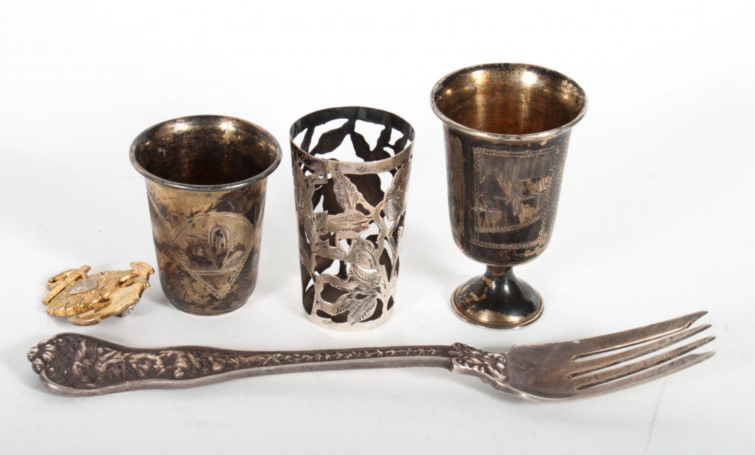 Tiffany & Co. "Olympian" sterling silver fork: circa 1878, together with two Russian silver jiggers, a Mexican silver shot glass frame, and a gilt silver nautical push pin; 3.95 ozt