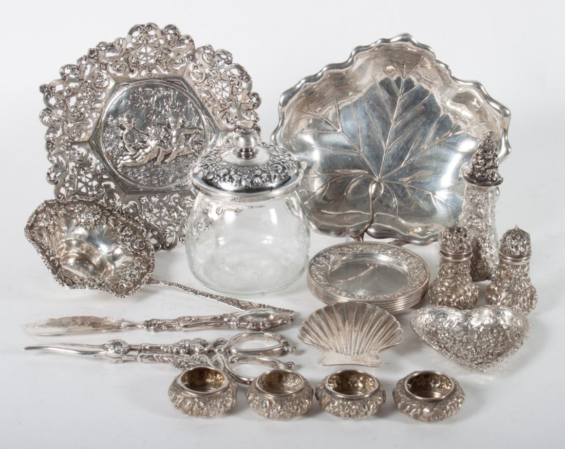 Group of American sterling silver table articles: including: 6 Gorham nut dishes, 4 Stieff salt cellars, pair of Stieff salt & pepper shakers and another shaker, small Stieff heart dish, small Tiffany shell dish, leaf-form dish, Kirk sterling lidded 
