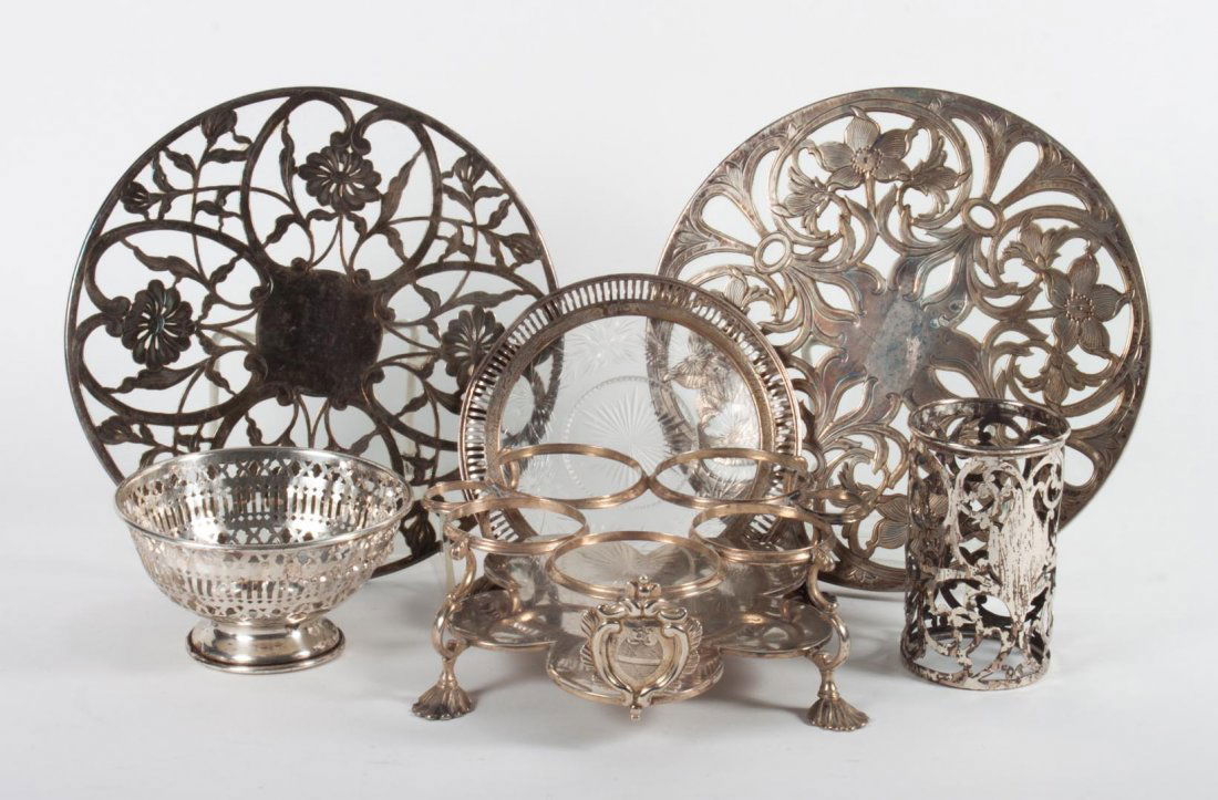 George III sterling silver cruet stand base: no bottles; together with a sterling filigree cup casing, a sterling bowl casing, two silver filigree glass trivets, and a silver rimmed etched dish; 14.95 ozt. t.w.