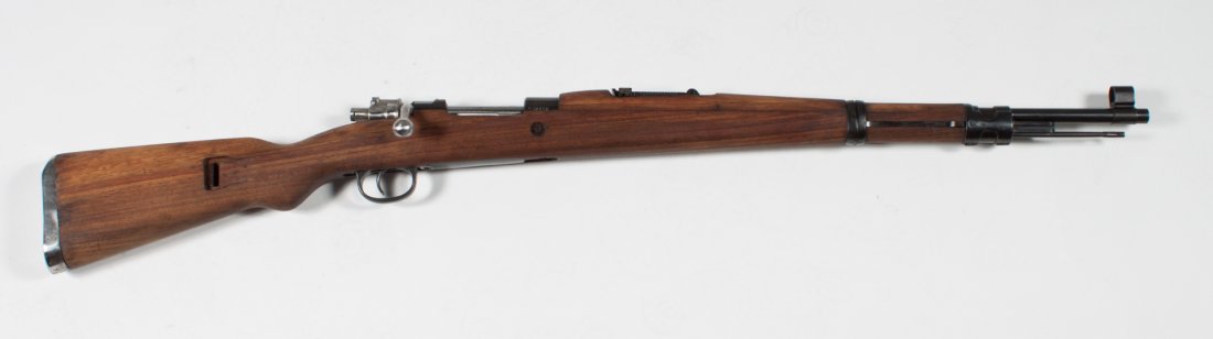 Jugoslavian Mauser Model 1898 bolt-action rifle: M48 version, serial #W13608, manufactured by Zastava, 1940s; 8 mm. cal.; the barrel 24 in. L.; metal parts with blued finish; walnut stock and handguard; 42 1/2 in. L. overall; together with bayonet, 