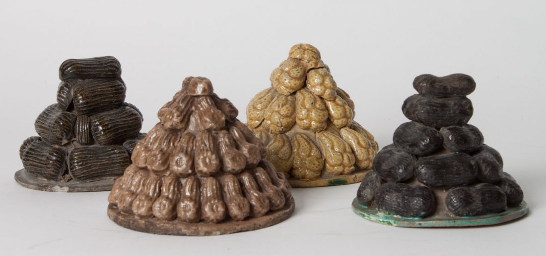 Four Chinese porcelain Buddhists votive offerings: 19th century; each modeled as stack of nuts and squash, 3 in. H., 3 1/2 in. Diam.