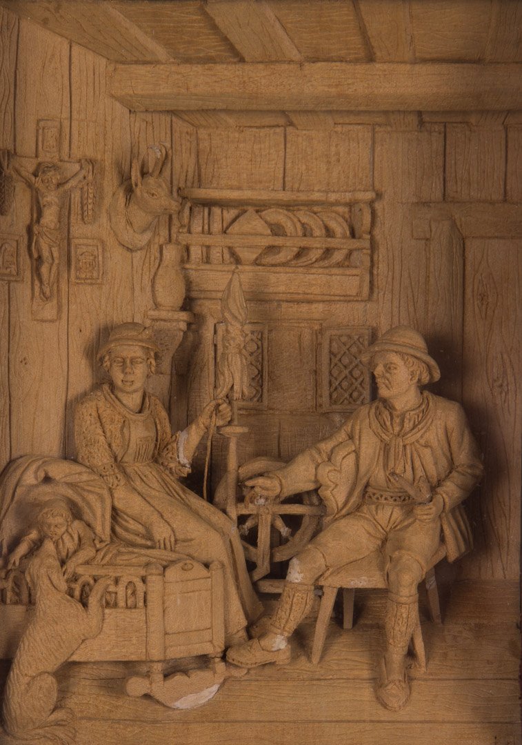 Continental carved boxwood diorama: first half-20th century; probably German, carved relief scene of domestic interior in velvet matted shadowbox frame, 10 1/2 in. L., 9 in. W.