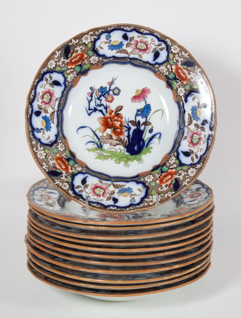 Twelve Minton & Hollins iron stone soup bowls: mid 19th century; in the "Japanese" pattern. Imari style floral decoration, 10 in. Diam.